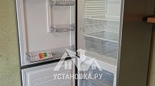 Установить холодильник отдельностоящий и перевесить на нём двери