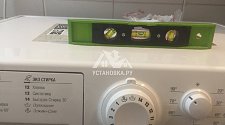 становить в ванной комнате новую стиральную машину Ariston VMSL 5081 B