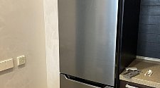 Установить бытовой холодильник и перевесить двери