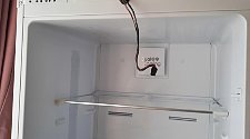 Установить холодильник отдельностоящий и перевесить двери на холодильнике