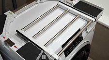 Установить стиральную и сушильную машины в колонну