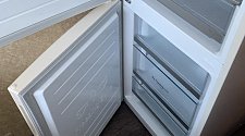 Установить холодильник отдельностоящий и перенавесить на нём двери