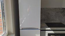 Установить холодильник отдельностоящий и перенавесить двери на нём