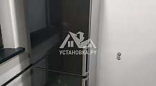 Установить холодильник отдельностоящий и перевесить двери на нём