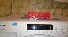 Произвести установку новой отдельно стоящей ванной комнате стиральной машины Candy
