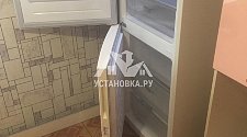 Установить холодильник отдельностоящий и перевесить двери на нём