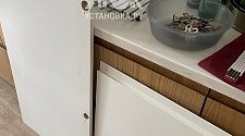 Установить встраиваемый холодильник и перенавесить на нём двери
