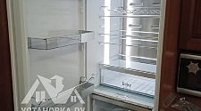 Установить встраиваемый холодильник и перенавесить на нём двери