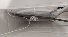 Установить на подготовленное место в ванной комнате стиральную машину Hotpoint Ariston