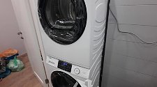 Установить стиральную и сушильную машины в колонну