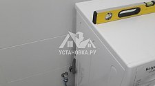 Установить новую отдельностоящую в ванной комнате на готовые коммуникации стиральную машину Hotpoint Ariston