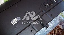 Установить на телевизионную тумбу и настроить новый телевизор LG