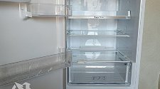 Установить холодильник отдельностоящий и перенавесить двери 