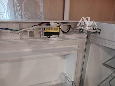 Перенавесить двери холодильника